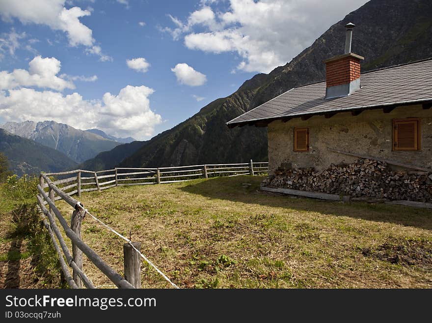 Brick house in the mountains looking over a valley