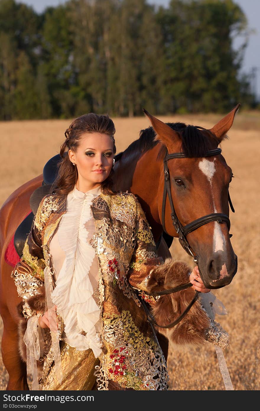 The young woman in clothes of 18 centuries with horse outdoors. The young woman in clothes of 18 centuries with horse outdoors