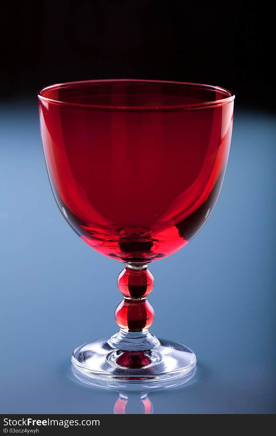 Red glass on the blue glass table