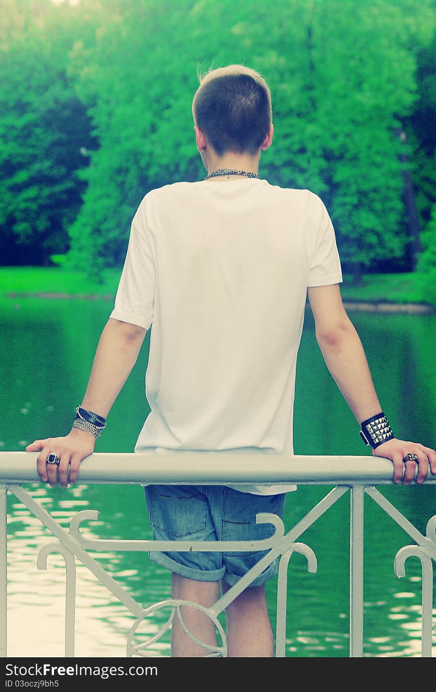 Young man looking at the lake