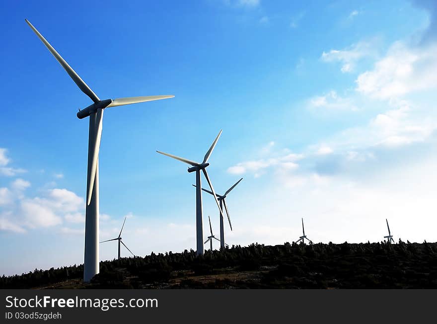 Wind turbines, sunset time. Region of perpignan, summer time. Wind turbines, sunset time. Region of perpignan, summer time.