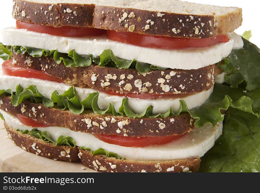 Cheese, tomato and lettuce sandwich on whole-grain bread