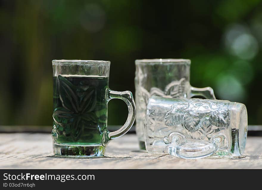 Image of glass with green water