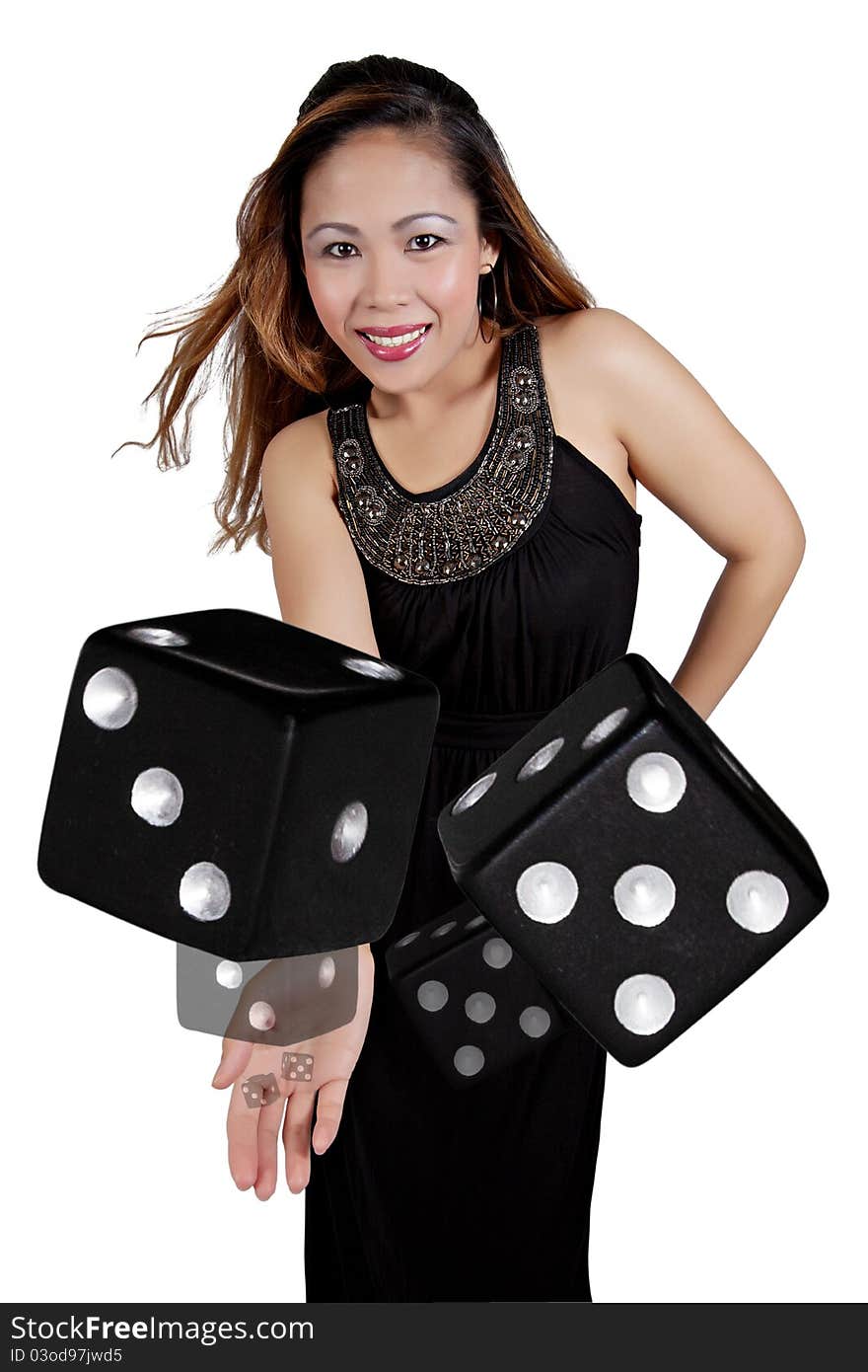 Asian Female Tossing a Pair of Black Dice. Asian Female Tossing a Pair of Black Dice