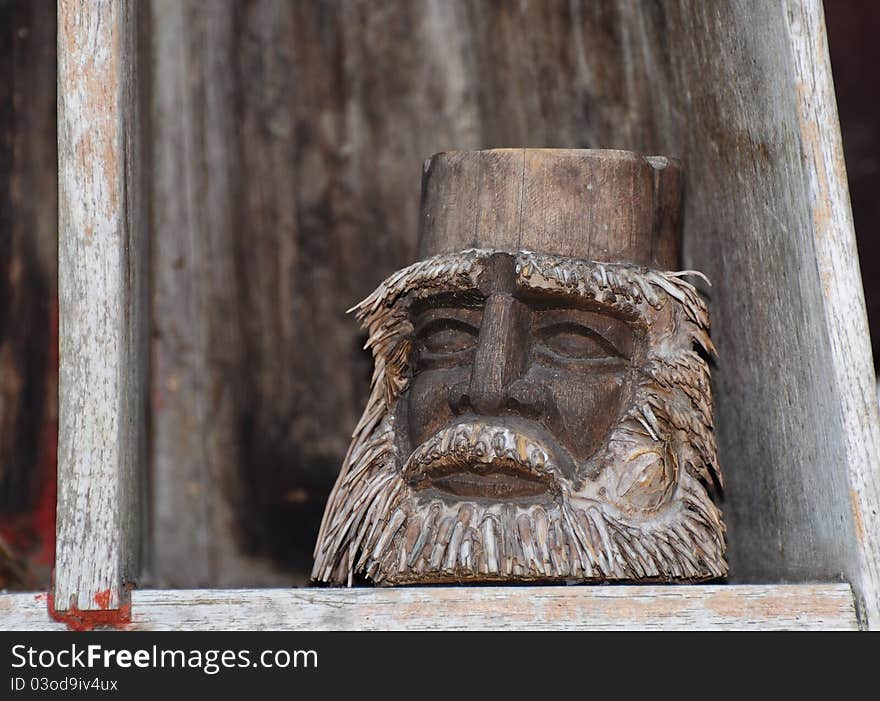 Face of human carved from bamboo