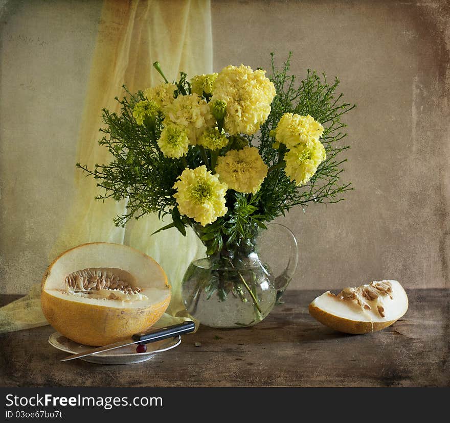 Bouquet of yellow marigolds and melon