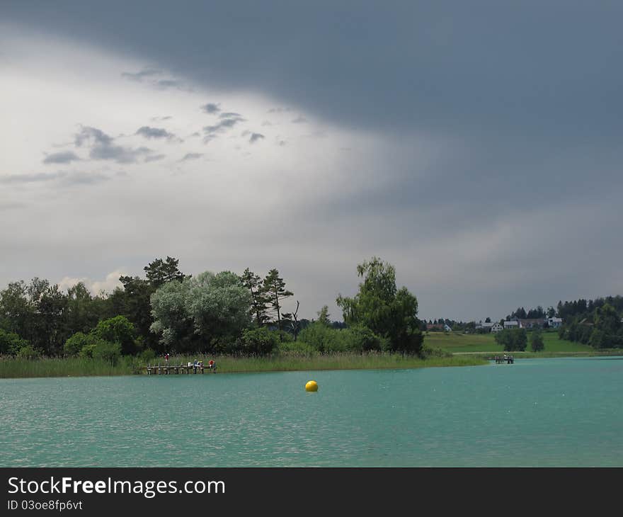 Clouds over the lake. Place for fishing and swimming.