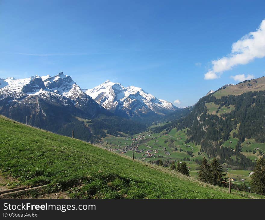 Mountains, called Oldenhorn and Schlauchhorn in the spring. Famous region of Saanenland. Place for summer skiing. Village called Gsteig bei Gstaad. Mountains, called Oldenhorn and Schlauchhorn in the spring. Famous region of Saanenland. Place for summer skiing. Village called Gsteig bei Gstaad.