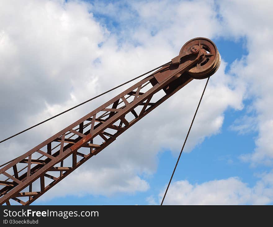 Silhouette of a crane boom.