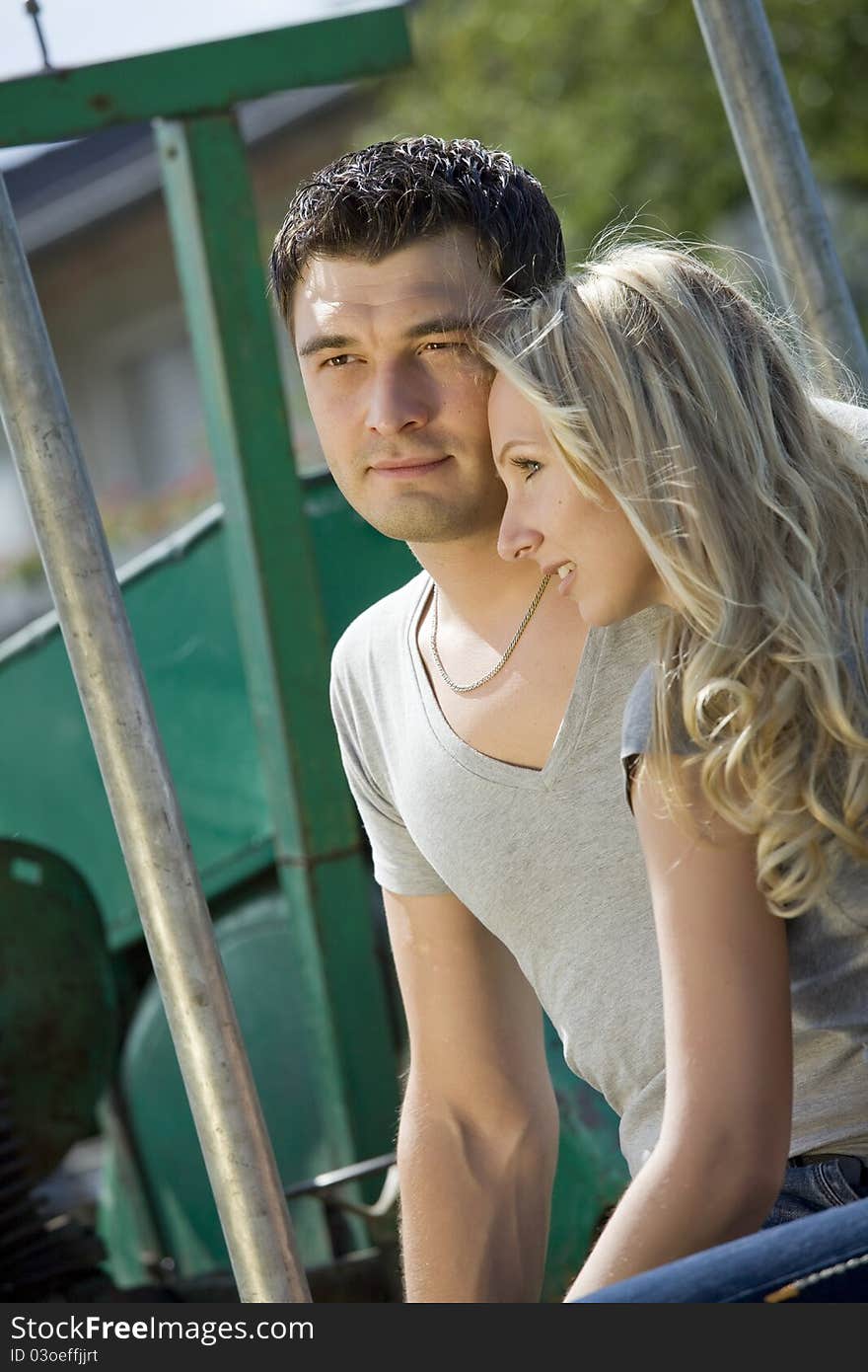 Woman cuddling with her boyfriend in countryside