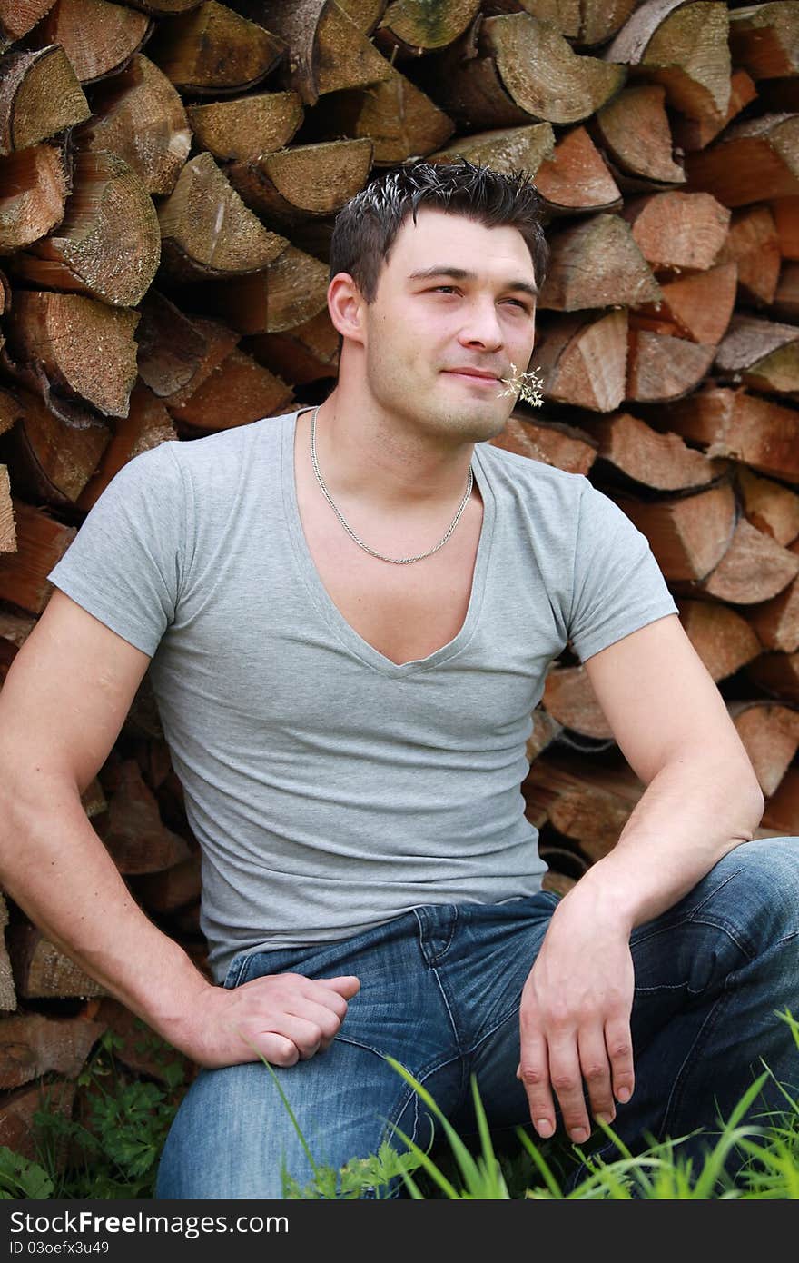 Portrait of handsome masculine man in countryside