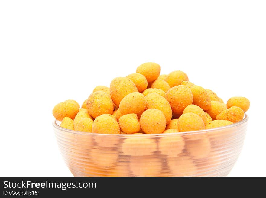 Chili nuts in a bowl on white background.