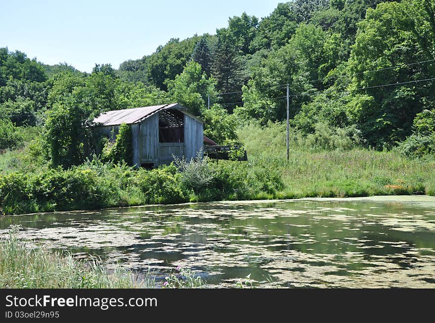 Old abandoned barn by pond in Illinois. Old abandoned barn by pond in Illinois