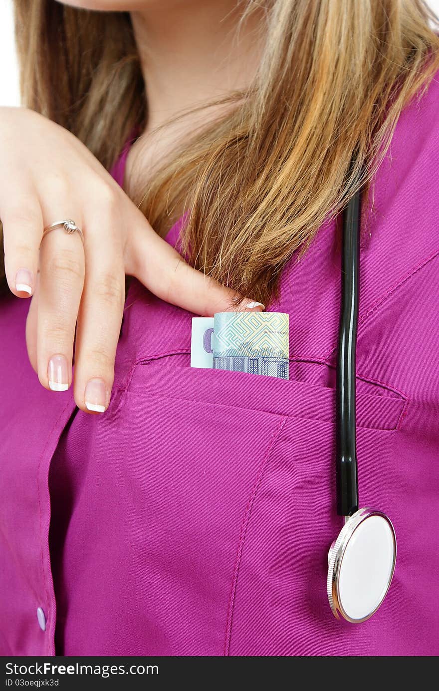 Beautiful nurse with stethoscope and money in her pocket