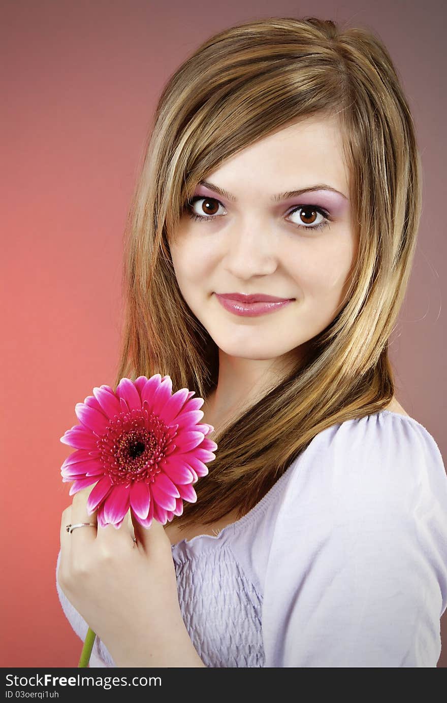 Attractive smiling woman portrait on red background