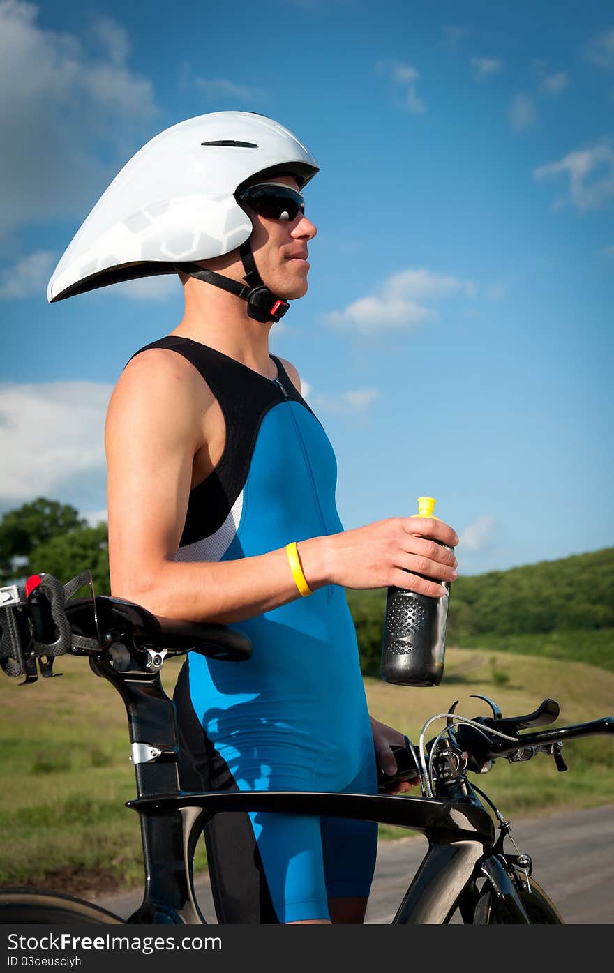 Athletic boy is drinking water