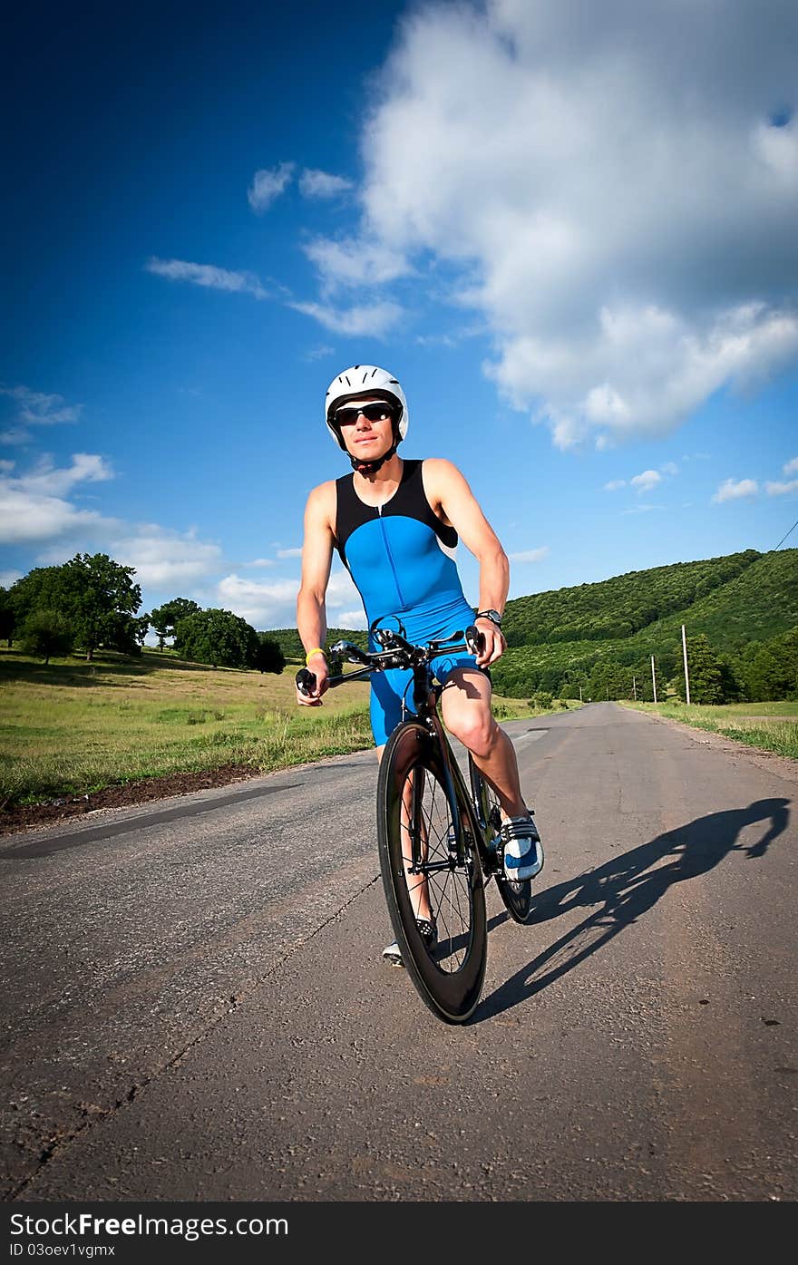 Athletic boy posing with his bike