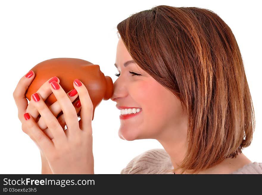 Young woman holding a piggy bank