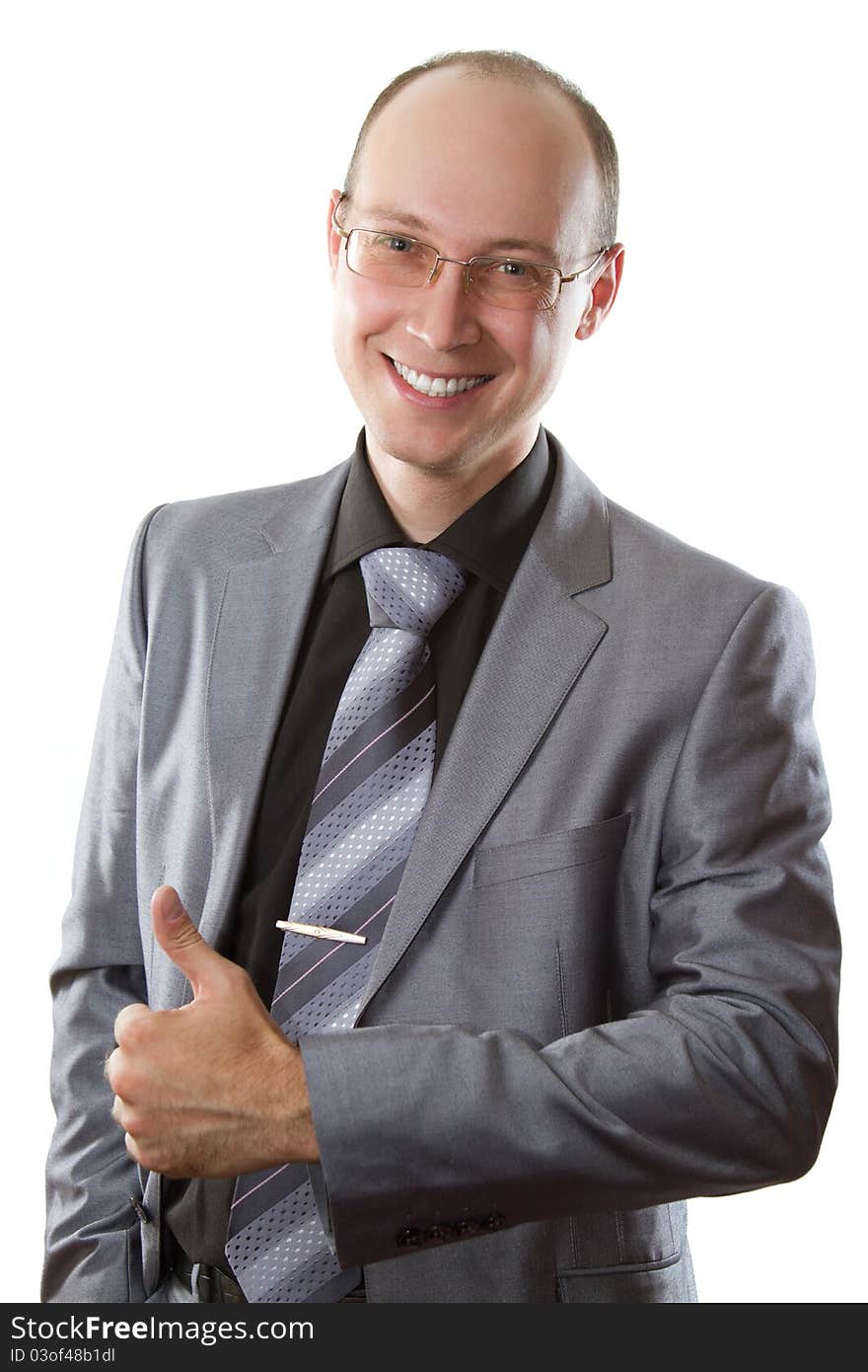 Smiling business man with his finger shows positiv