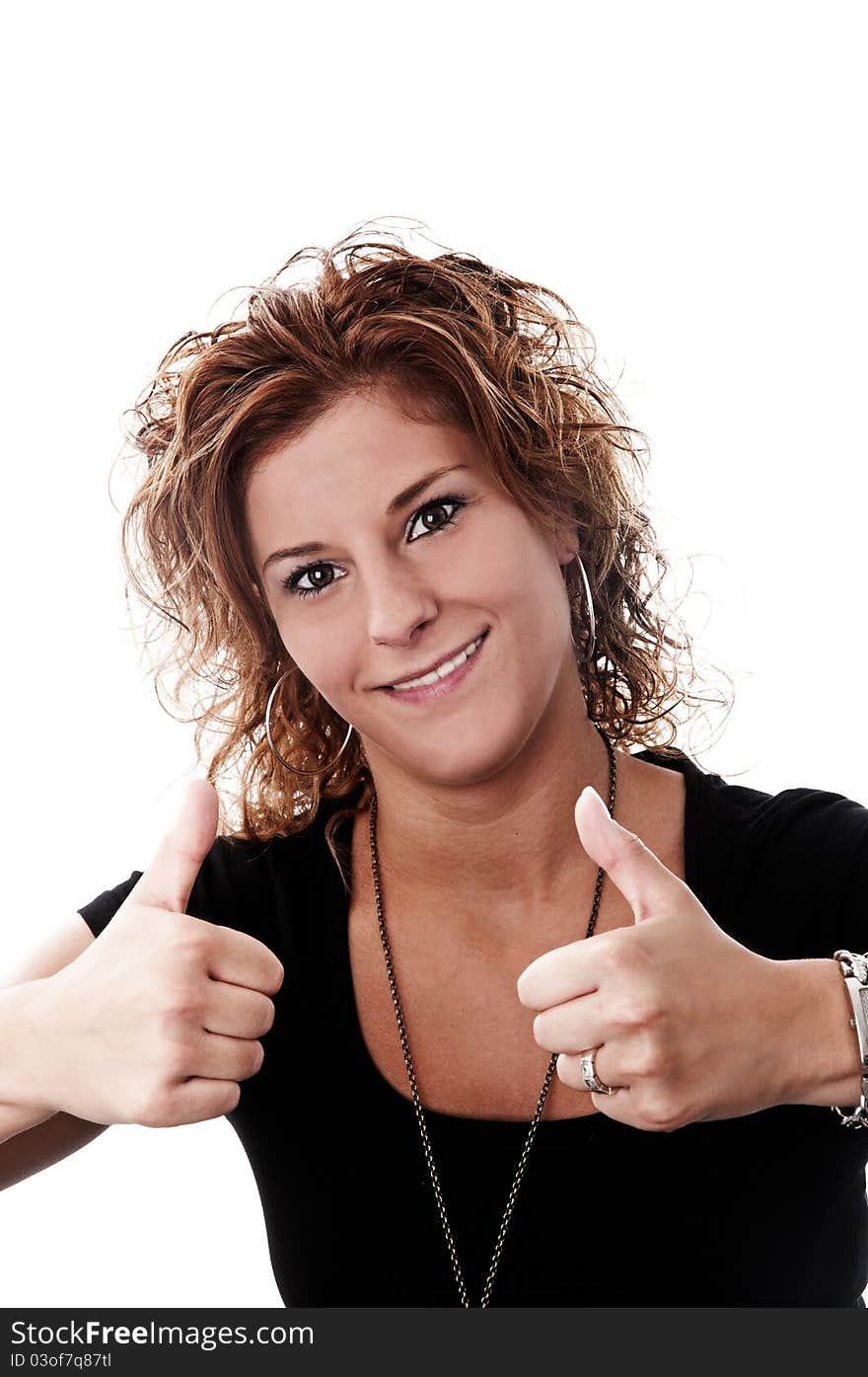 A young attractive woman with thumbs up taken in a studio with a white background perfect for cutout.