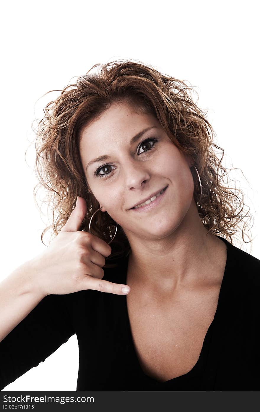 A young attractive woman making a call sign taken in a studio with a white background perfect for cutout.