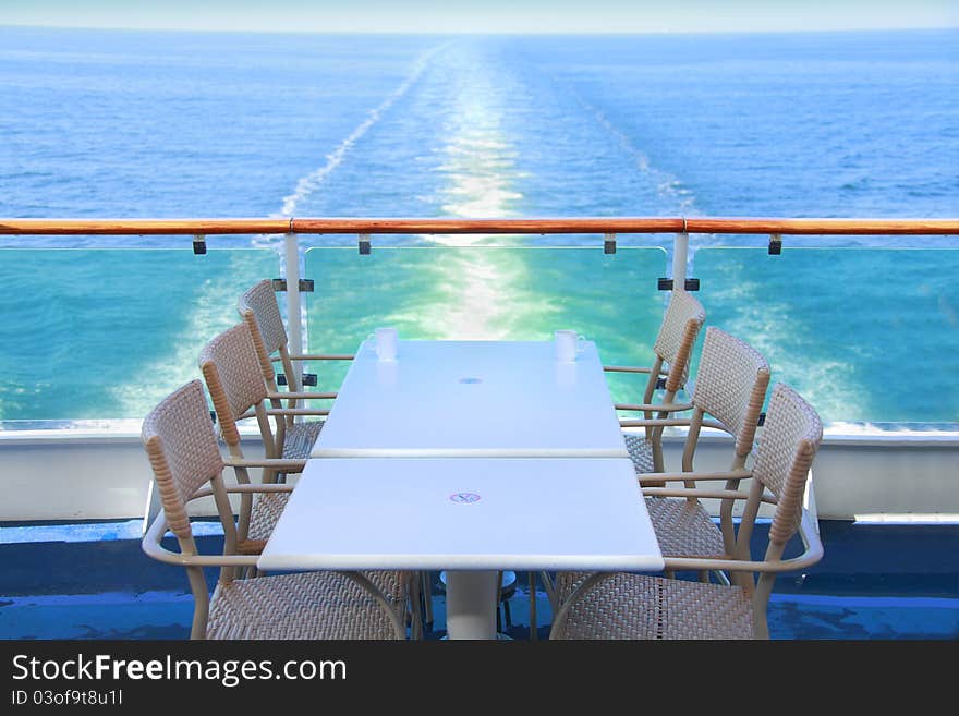 Dining table and chairs with ocean view