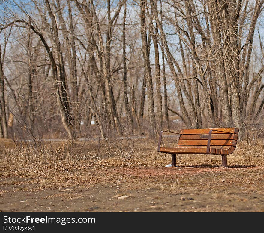 Park bench in bow valley park pathway Calgary Alberta. Park bench in bow valley park pathway Calgary Alberta