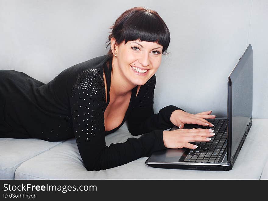 Woman Working With Laptop In Home