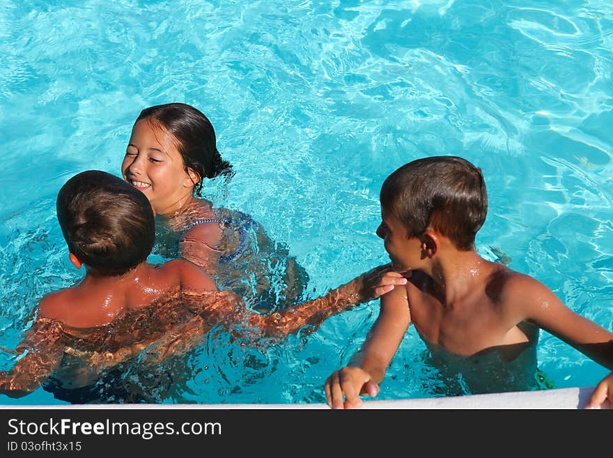 Children playing in a pool. Children playing in a pool