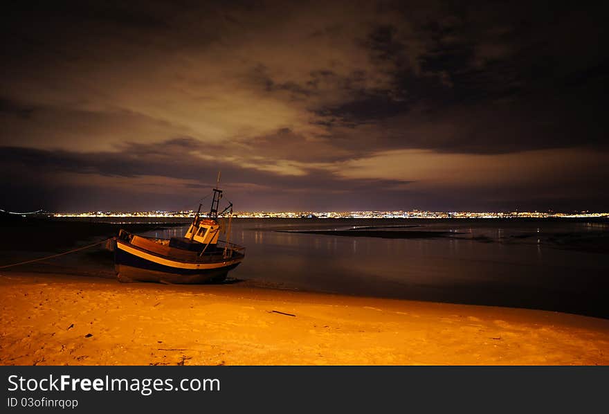 Fishing boat on shore at night. Fishing boat on shore at night