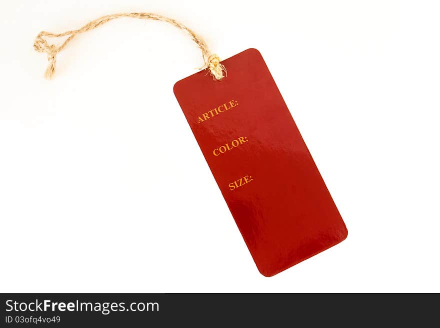 Red paper label with rope on a white background