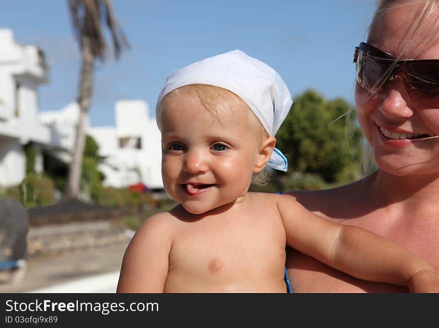 Smilling Mother And Daughter Near Pool