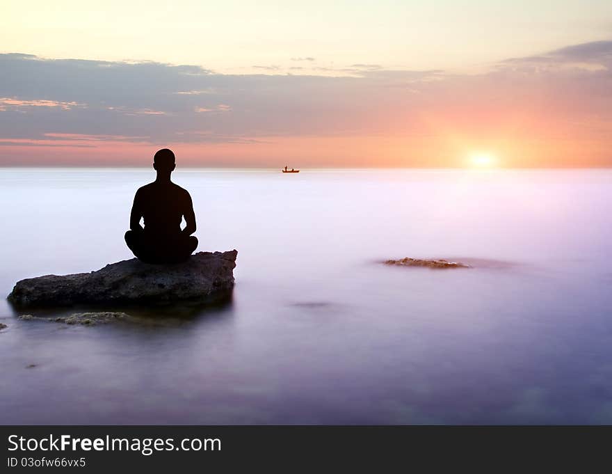 Sea and rock at the sunset. Seascape composition.