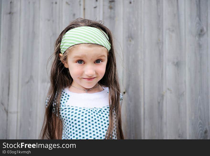 Outdoors portrait of adorable amazed child girl