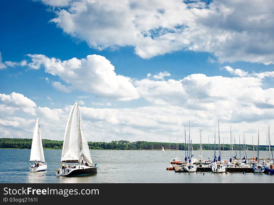 Yachts on an anchor in harbor, boats series