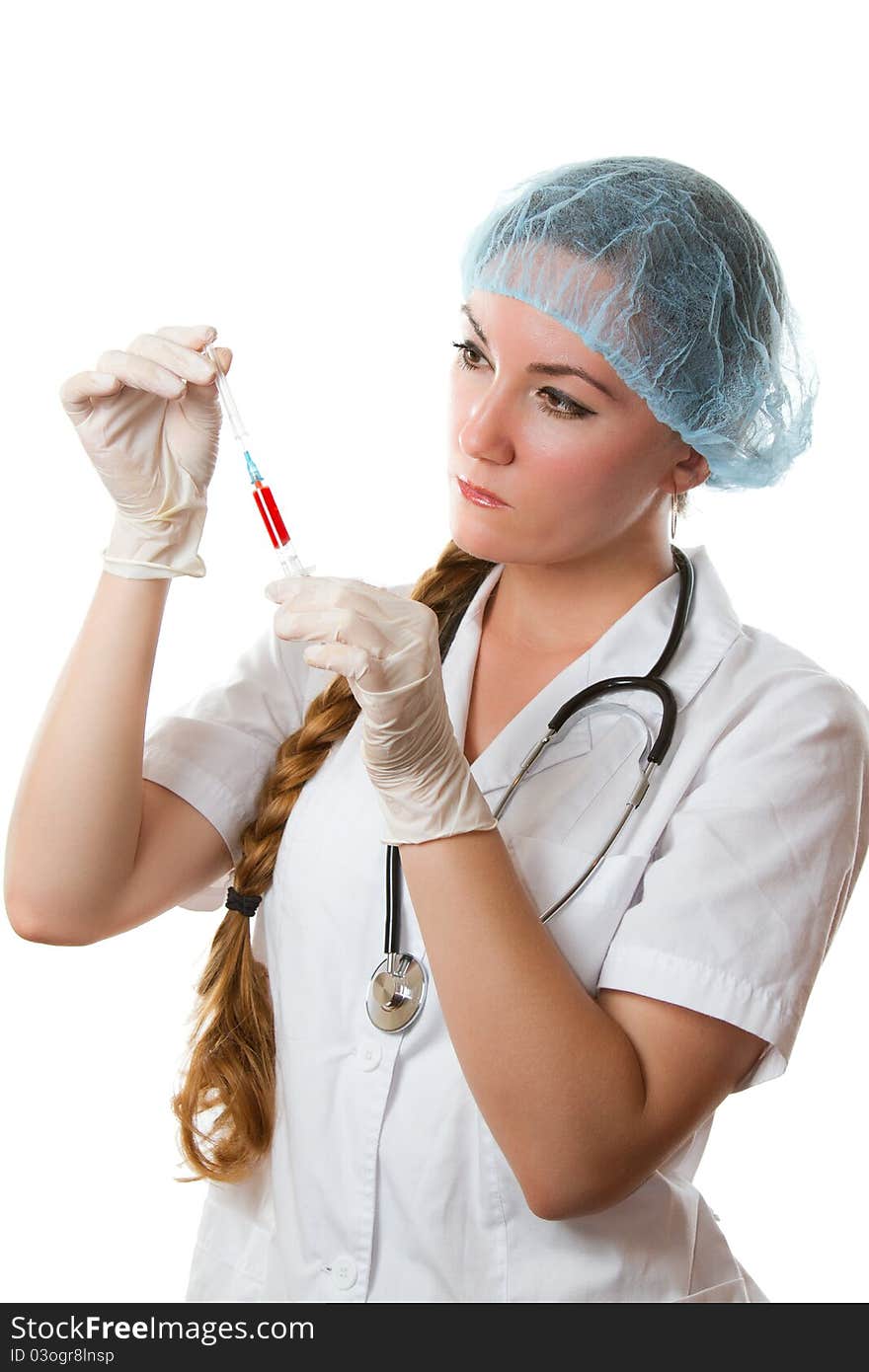 Beautiful nurse with long hair in a white robe holding a syringe with blood on an isolated white background. Beautiful nurse with long hair in a white robe holding a syringe with blood on an isolated white background