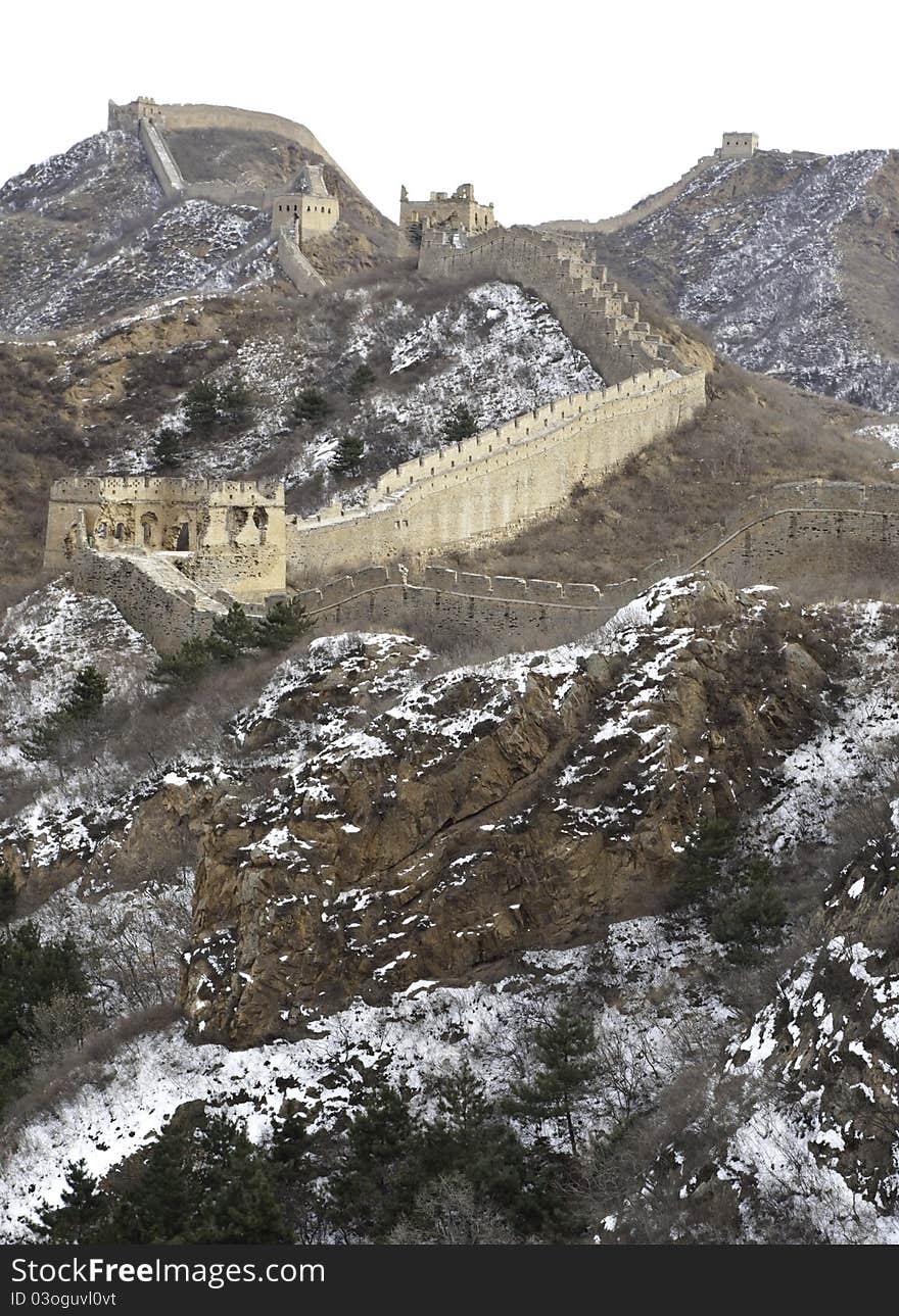 Distant view of the great wall of china with snow on the mountain. Distant view of the great wall of china with snow on the mountain