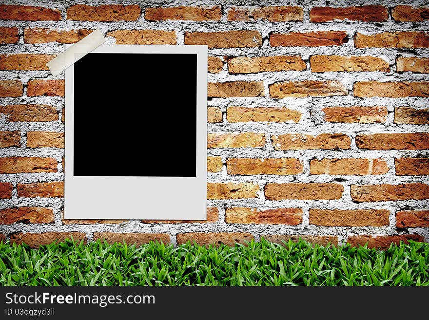 Blank photo on brick wall