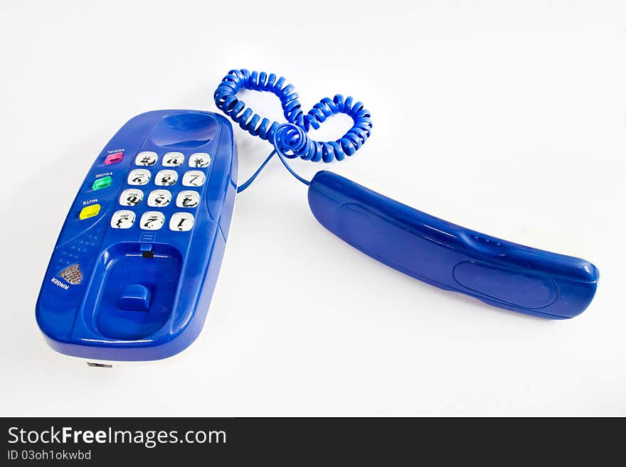 Isolated telephone with heart-shaped line