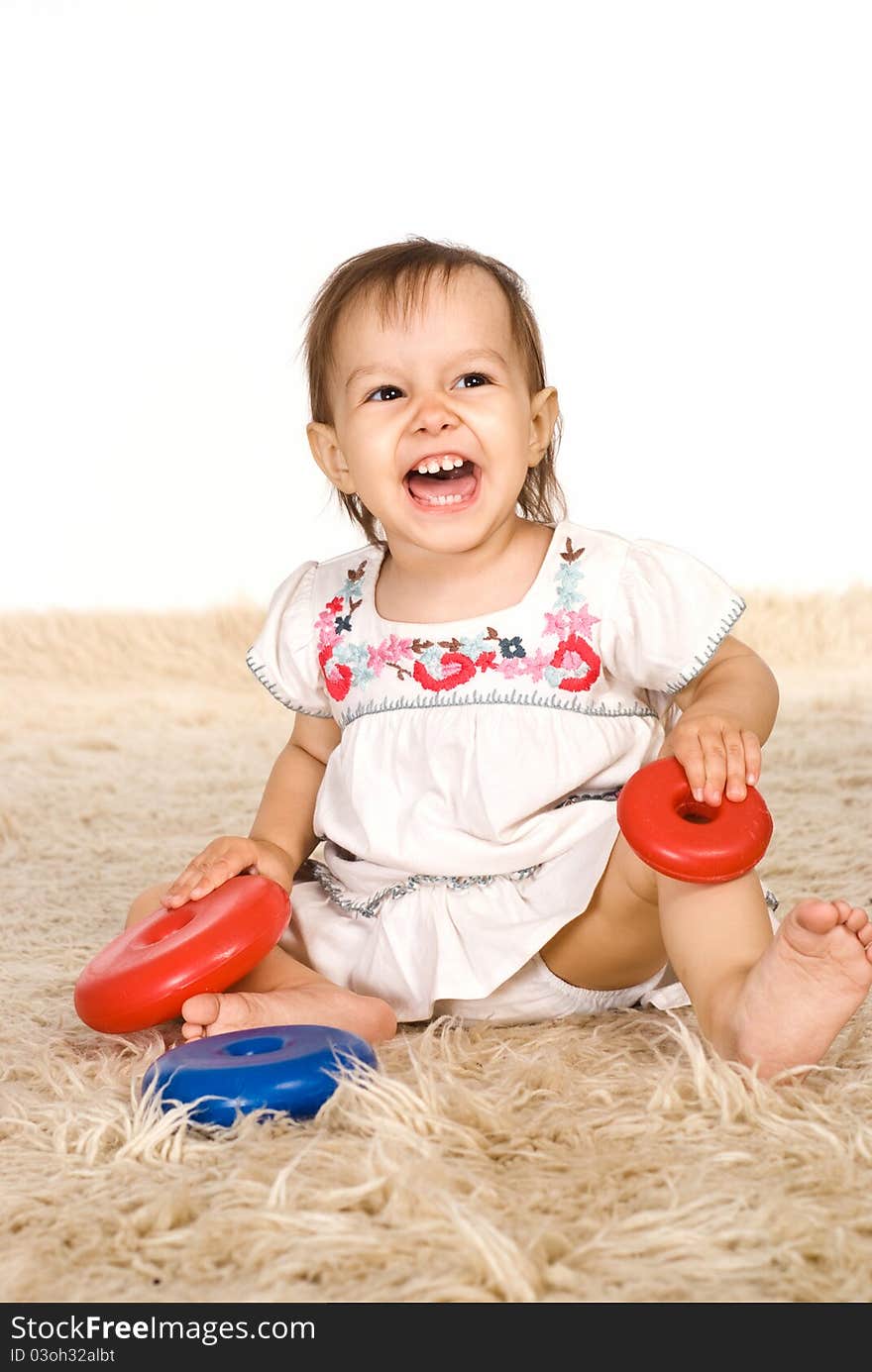 Girl playing on carpet