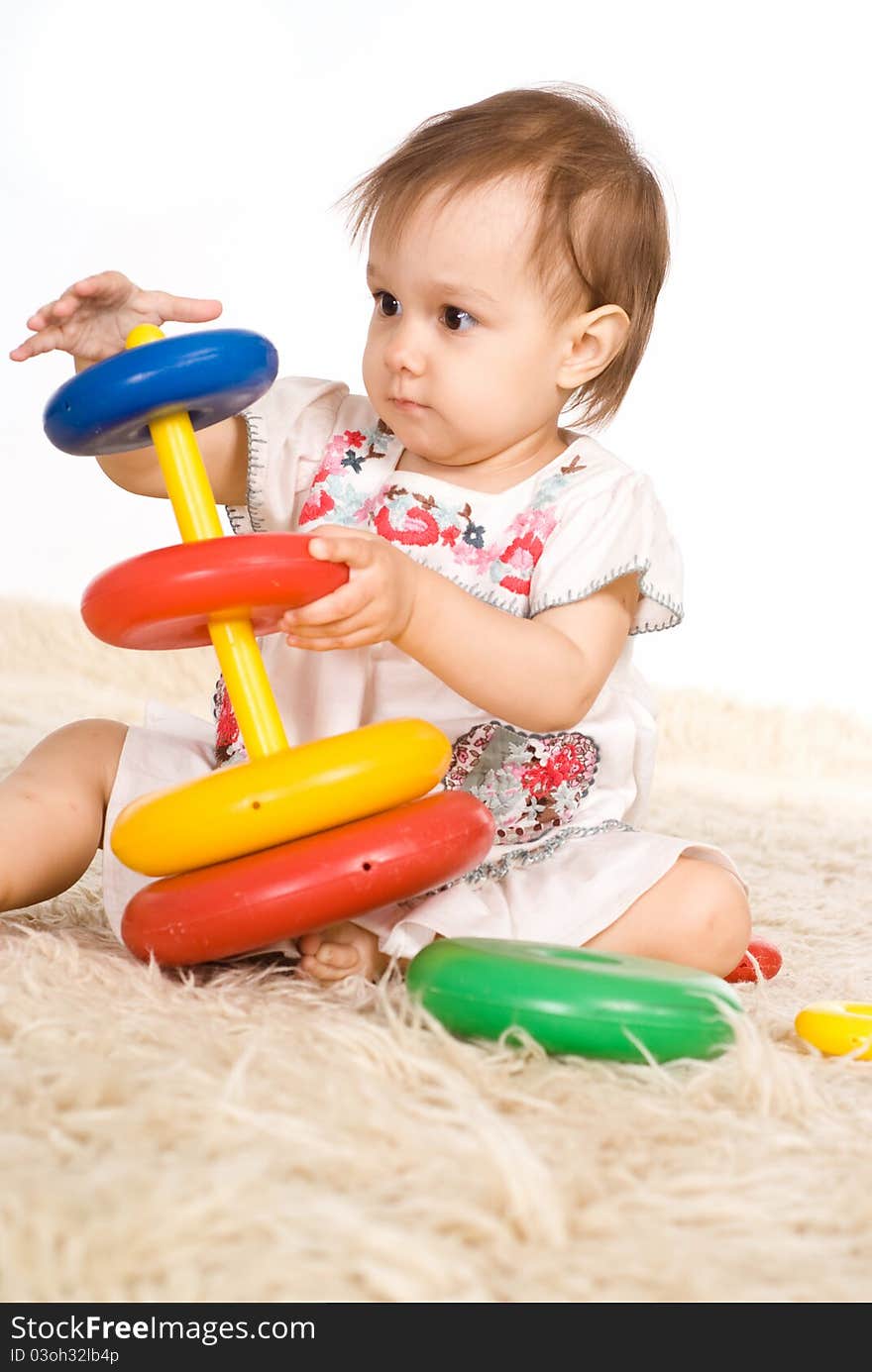 Girl Playing On Carpet