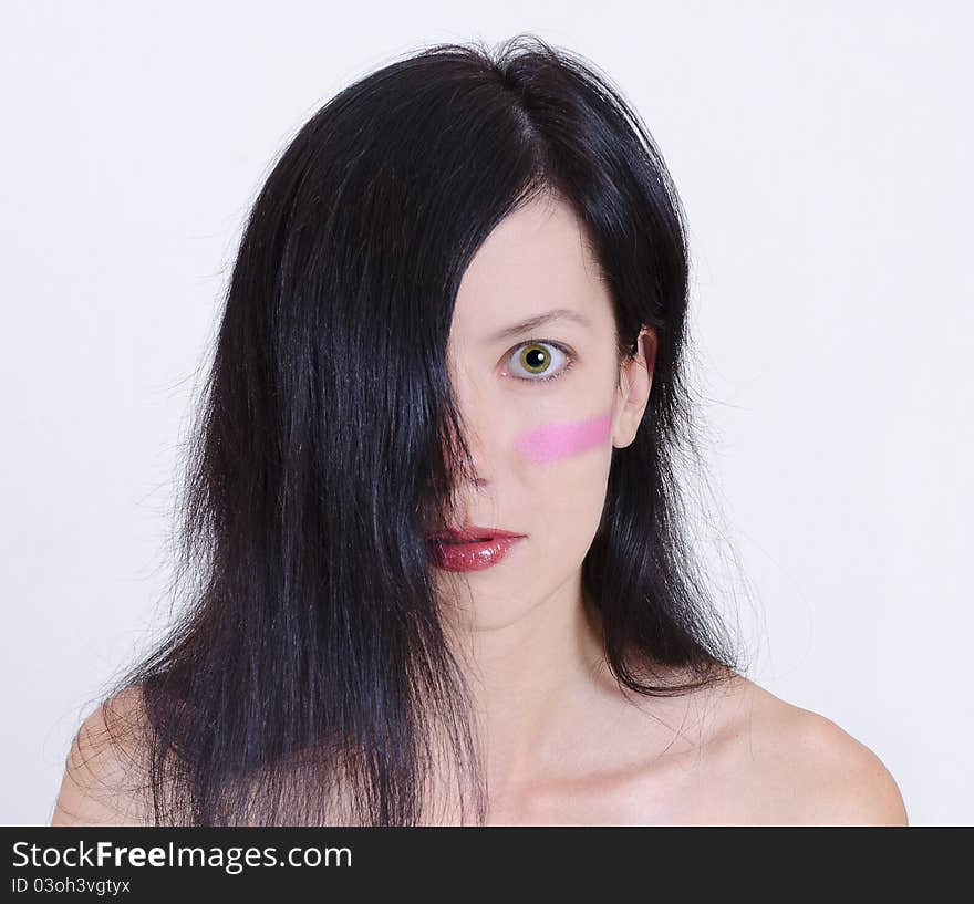 Girl with a pink stripe on her face. Girl with a pink stripe on her face