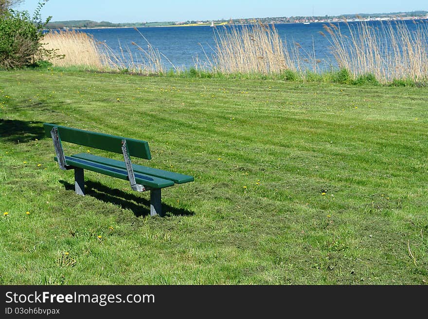 Bench over looking out to the sea ocean with beautiful landscape