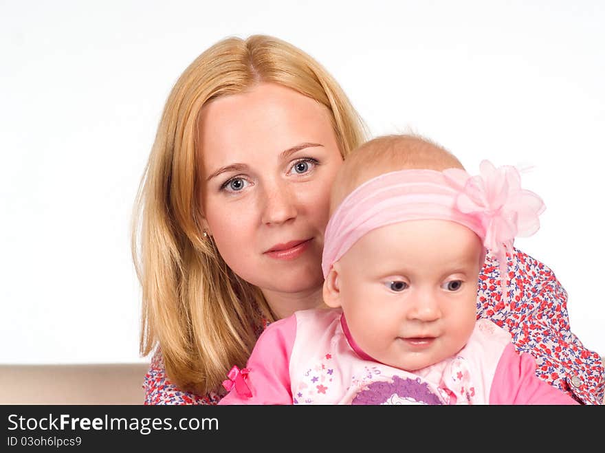 Cute mom with daughter on a white. Cute mom with daughter on a white