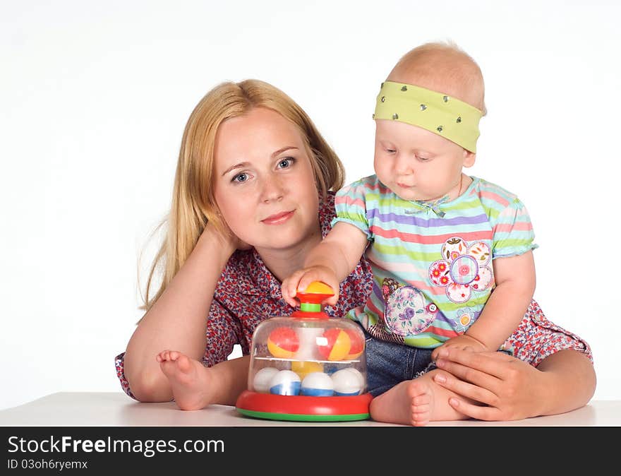 Cute mom with daughter on a white. Cute mom with daughter on a white