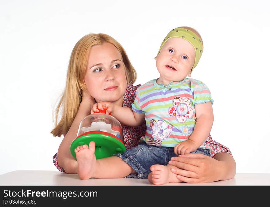 Cute mom with daughter on a white. Cute mom with daughter on a white