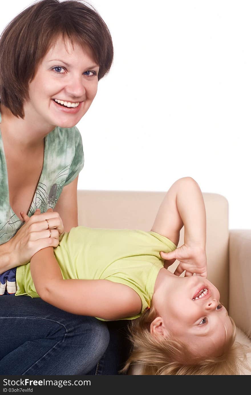 Portrait of mom and daughter on sofa. Portrait of mom and daughter on sofa