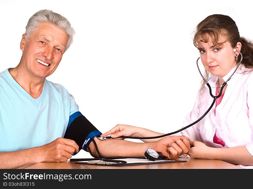 Old man with nurse sit at table on white. Old man with nurse sit at table on white