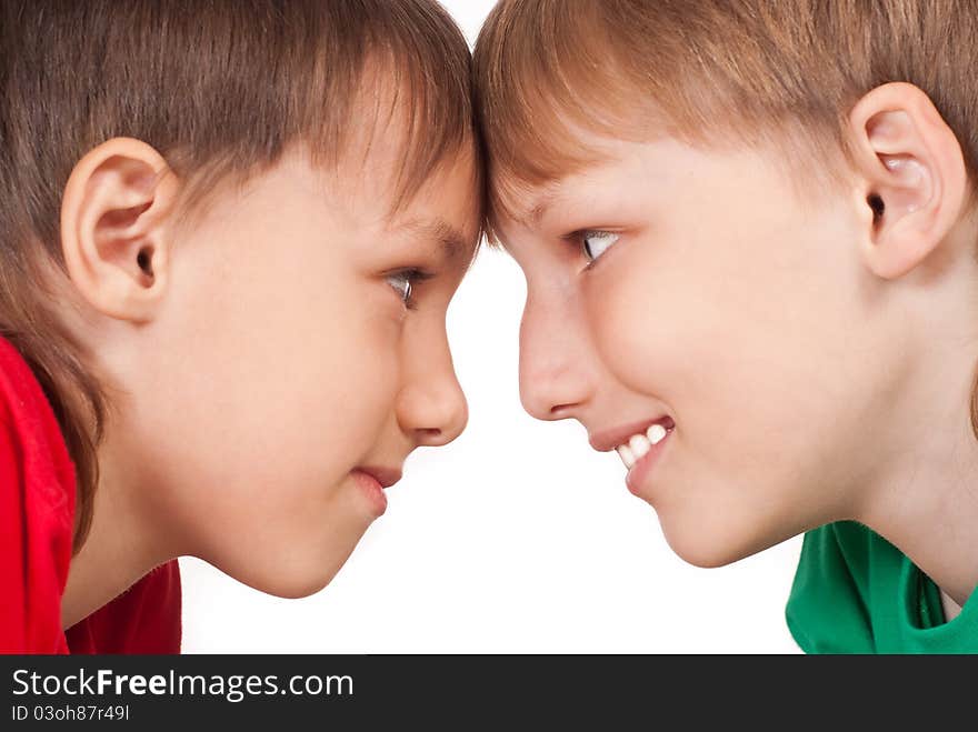 Portrait of a two boys playing on white