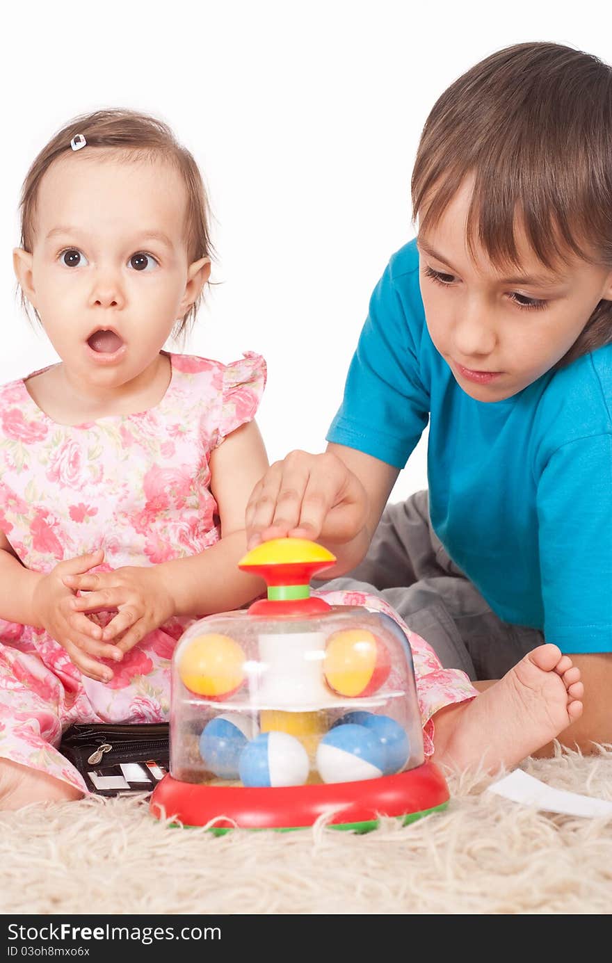 Portrait of a sister and brother playing